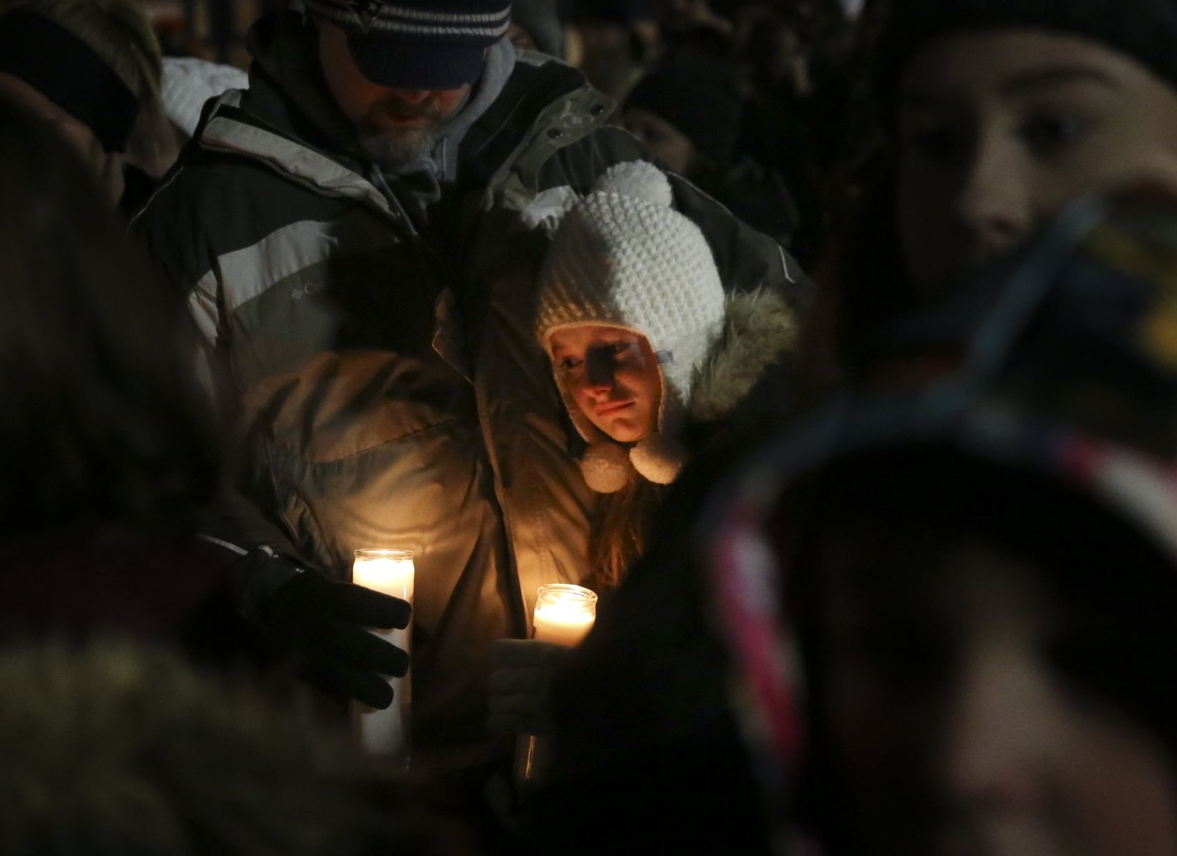 Shock, sorrow at candlelight vigil for St. Charles family